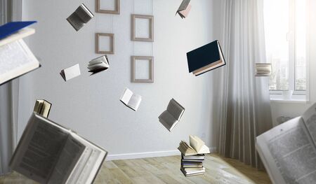 Image of room full of flying books. Mixed mediaの写真素材