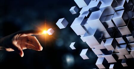 Hand holding glowing cubes. Innovation and creativity concept. Mixed mediaの写真素材