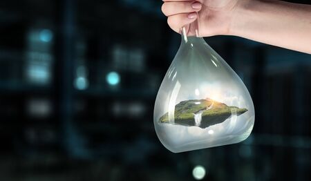Environment concept with mountain inside glass bottle. Mixed media
