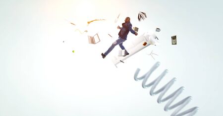 Businessman jumping on springboard . Mixed mediaの写真素材