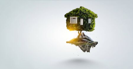 Little Eco House on the green grass concept. Mixed mediaの写真素材