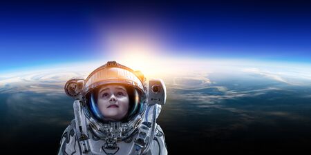 Little astronaut on planet orbitの写真素材