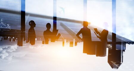 Group of business people outlines with lit backgroundの写真素材