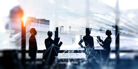 Group of business people outlines with lit backgroundの写真素材