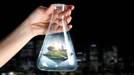Real estate concept with building inside glass flusk. Mixed mediaの写真素材