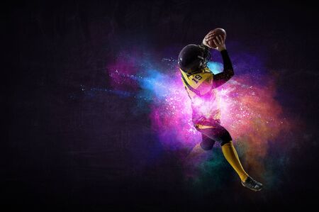 Boy playing soccer hitting the ball