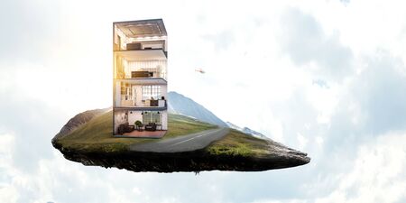 Real estate concept with floating building. Mixed media