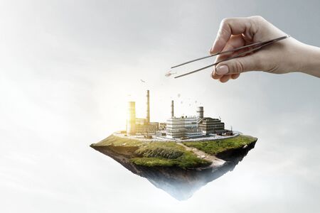 Floating industrial landscape with chimneys tank. Mixed mediaの写真素材