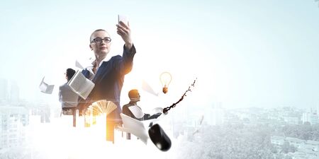 Business people taking selfie from phoneの写真素材