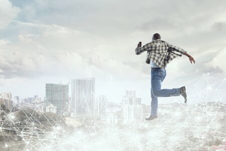 Black man in casual clothes in motion