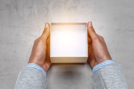 Hands holding open empty box