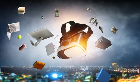 Image of floating virtual reality goggles. Mixed mediaの写真素材
