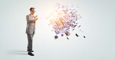 man wearing virtual reality goggles. Mixed mediaの写真素材