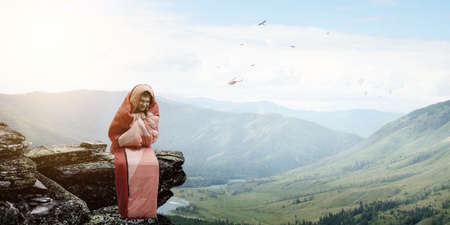 Young traveler in sleeping bagの写真素材