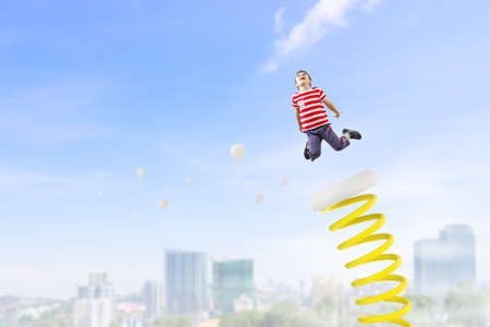 Kids jumping in the skyの写真素材