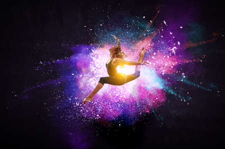 Female dancer against colourful backgroundの写真素材