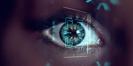 Close up of woman eye in process of scanningの写真素材