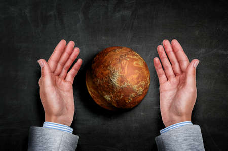 Hands holding planet . Mixed media