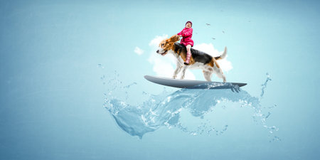 Little girl on the dog riding a surf boardの写真素材