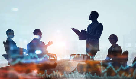 Group of business people outlines with lit backgroundの写真素材