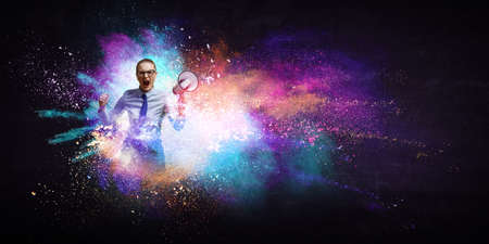 Businesswoman spraying paint . Mixed mediaの写真素材