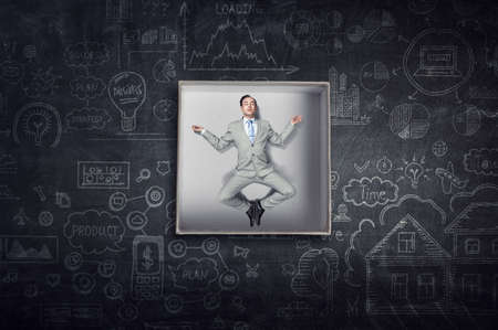 Businessman inside a box . Mixed mediaの写真素材