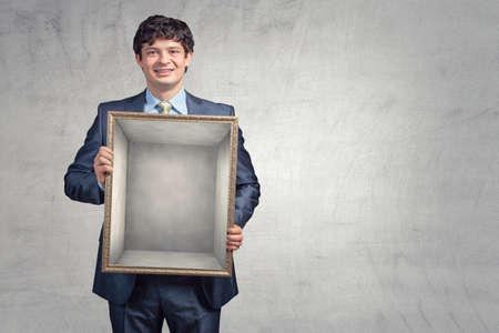 Man holding blank poster . Mixed mediaの写真素材