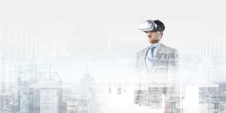 Businessman in VR glasses . Mixed mediaの写真素材