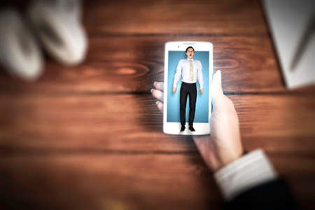 Businessman on the mobile phone screenの写真素材