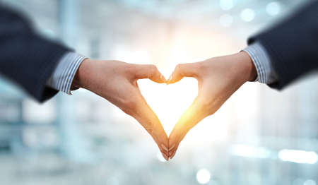 Female hands form heart shapeの写真素材