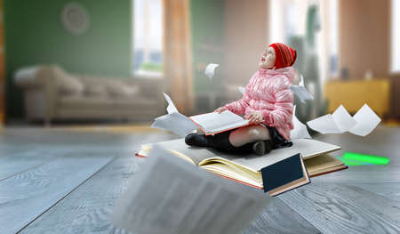 Little girl reading a bookの写真素材