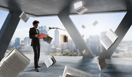 Room full of flying booksの写真素材