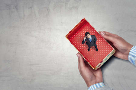 Businessman inside a box . Mixed mediaの写真素材
