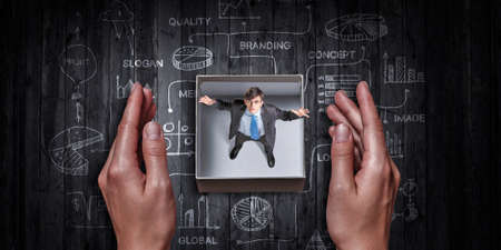 Businessman inside a box . Mixed media