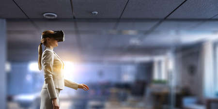 Woman wearing virtual reality gogglesの写真素材