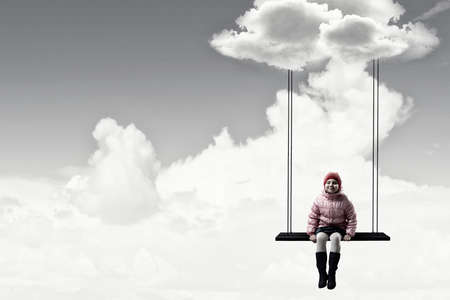 Girl sitting and dreaming of adventuresの写真素材