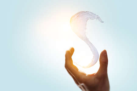 Hands with water splash . Mixed mediaの写真素材