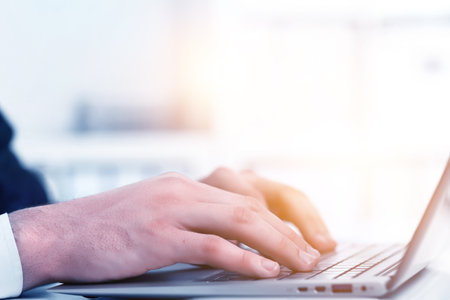 Hands of a businessman on keyboardの写真素材