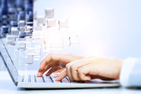 Hands of a young woman on keyboard