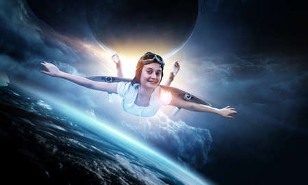 Girl flying with self-made plane wing. Mixed media