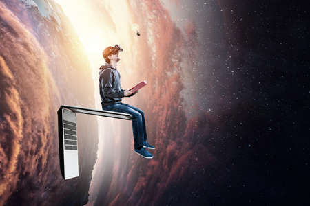 Virtual reality experience, young man in VR glasses. Mixed media