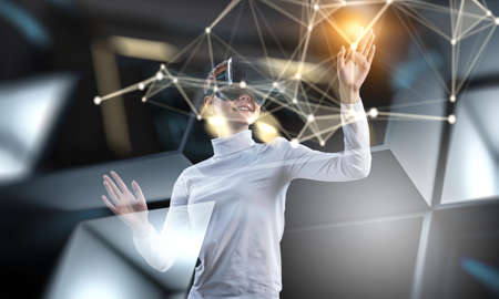 Woman wearing virtual reality gogglesの写真素材