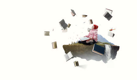 Little girl reading a bookの写真素材