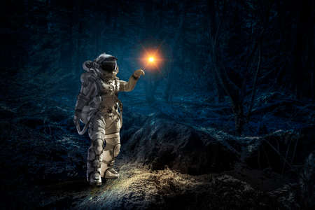 Astronaut walking on an unexplored planetの写真素材