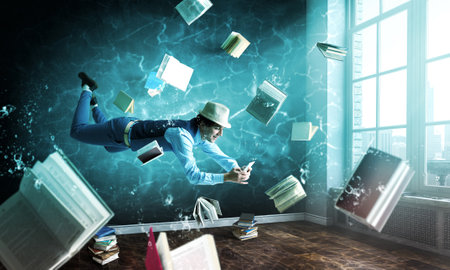 Man with mobile phone underwaterの写真素材