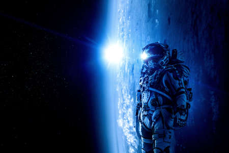 Astronaut walking on an unexplored planetの写真素材
