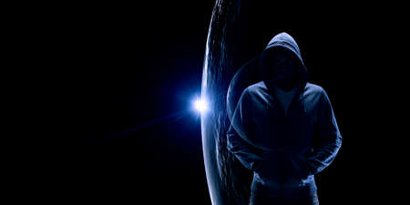 Silhouette of man in hoodyの写真素材