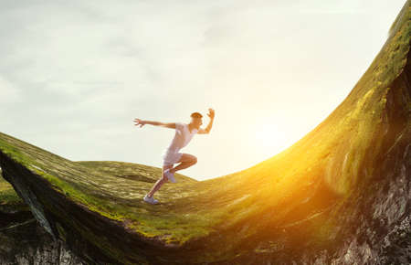 Man in sportwear running . Mixed mediaの写真素材