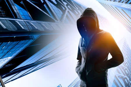 Silhouette of man in hoodyの写真素材