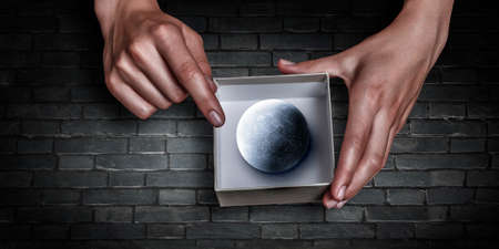 Hands holding planet . Mixed mediaの写真素材
